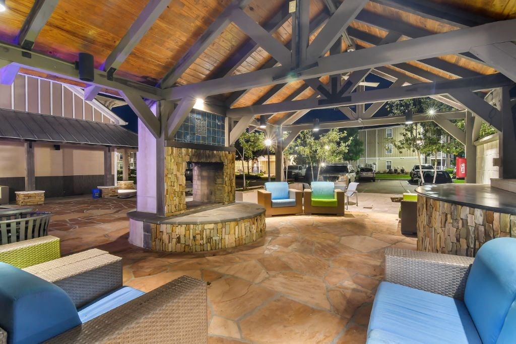 a lobby with couches and chairs and a fireplace  at Reserve at Gulf Hills Apartment Homes, Mississippi, 39564