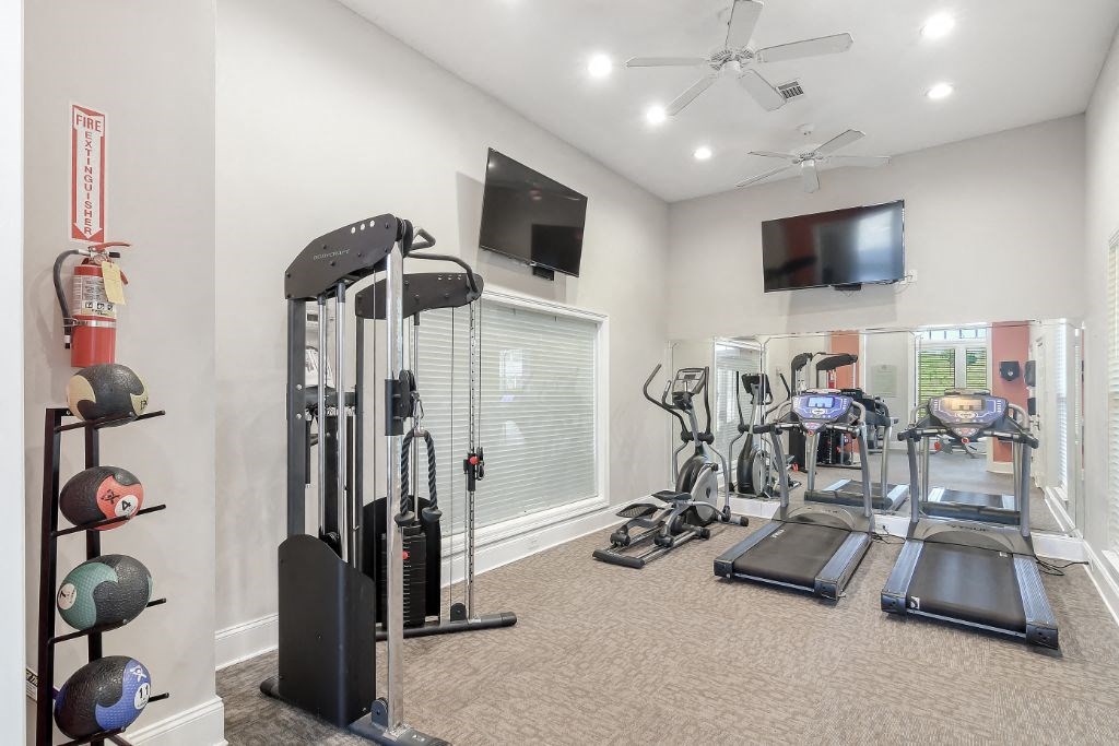 our apartments have a gym with equipment and a flat screen tv  at Lagniappe of Biloxi Apartment Homes, Biloxi, MS, 39532