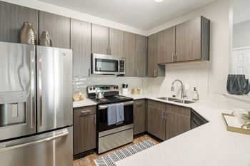 Stainless steel appliances at Lagniappe of Biloxi Apartment Homes in Biloxi, MS