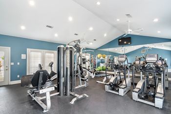 the gym is equipped with state of the art equipment including cardio machines and weightsat The Pointe Apartment Homes, Gautier, 39553