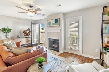 a living room with a couch and a fireplace at Reserve of Jackson Apartment Homes, Mississippi, 39211