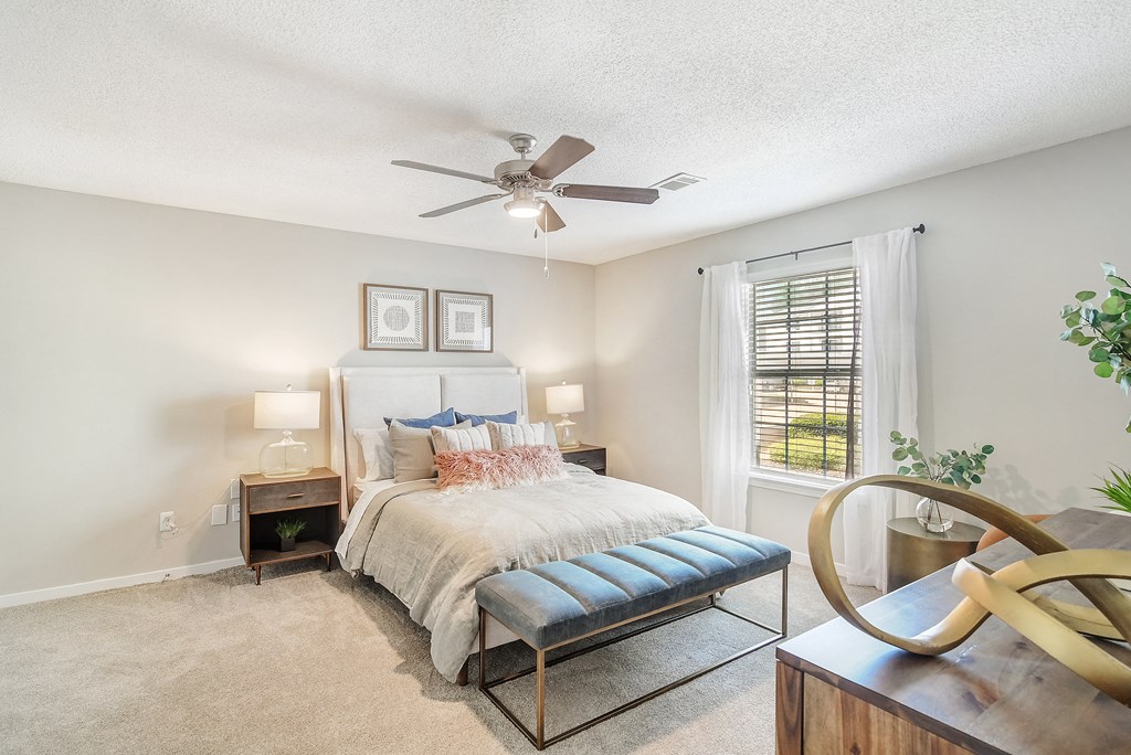 a bedroom with a bed and a ceiling fan a bedroom with a bed and a ceiling fan at Reserve of Jackson Apartment Homes, Mississippi, 39211