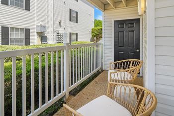 a patio with two chairs and a table on a balcony at Reserve of Jackson Apartment Homes, Jackson, 39211