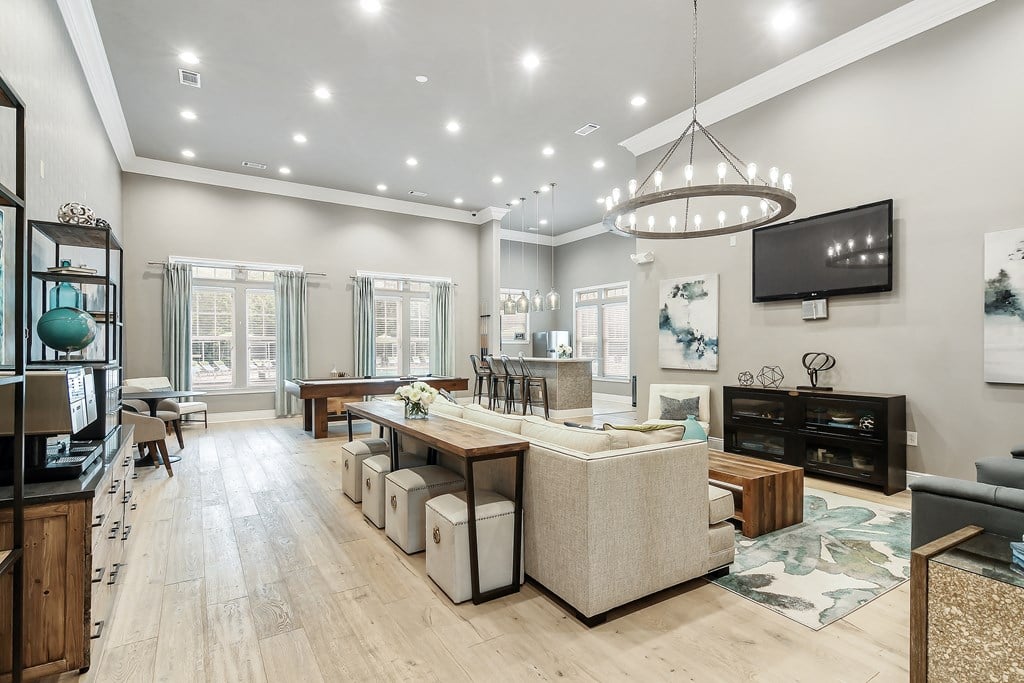 a living room with a couch and a table at Charleston Apartment Homes, Mobile, Alabama