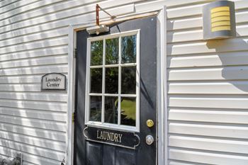 the door to the laundry room is painted black and has a window at Reserve of Jackson Apartment Homes, Mississippi, 39211