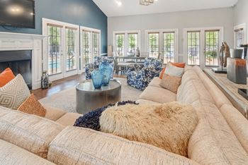 a living room with couches and a fire place at Reserve of Jackson Apartment Homes, Jackson, MS