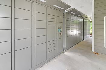 a row of lockers in a hallway of a building at Charleston Apartment Homes, Mobile, 36695