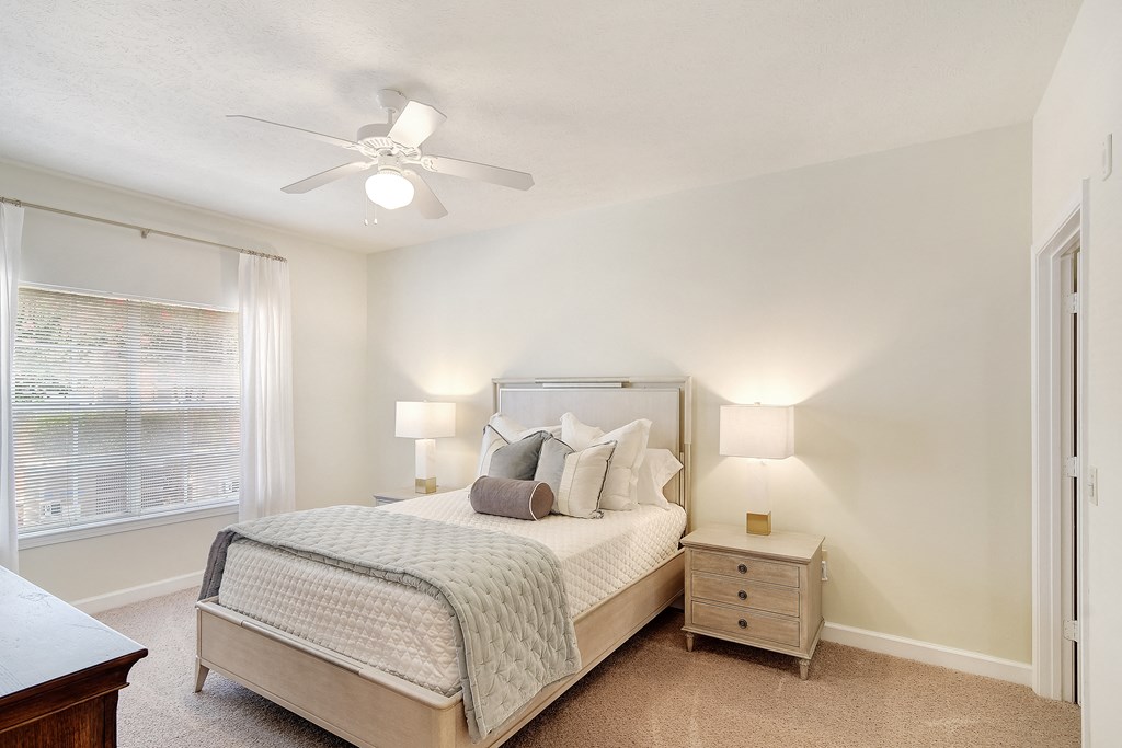 a bedroom with a bed and a ceiling fan at Summit of Shreveport Apartments, Shreveport, LA, 71105