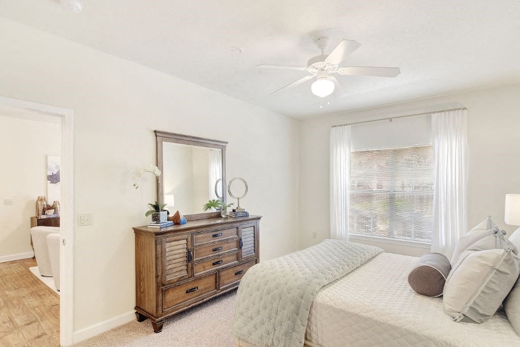 a bedroom with a bed and a dresser at Summit of Shreveport Apartment Homes, Shreveport, 71105