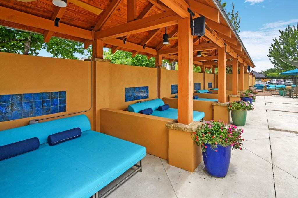 a row of cabanas with blue couches and potted plants at Summit of Shreveport Apartment Homes, Shreveport, 71105
