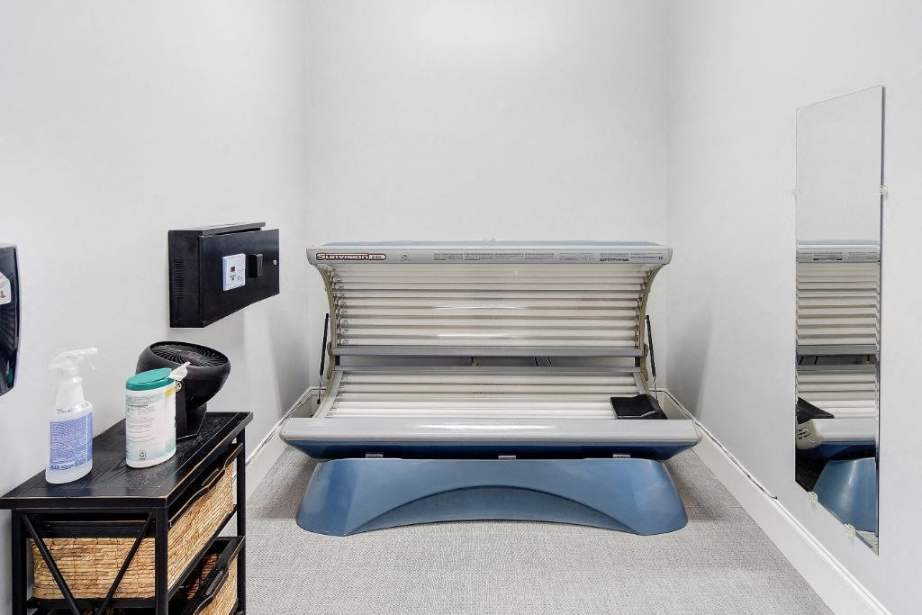 a room with an exam table and a mirror at Summit of Shreveport Apartment Homes, Shreveport, LA, 71105