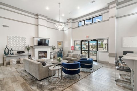 a living room with couches and chairs and a fireplace  at Parkwest Apartment Homes, Hattiesburg, MS, 39402