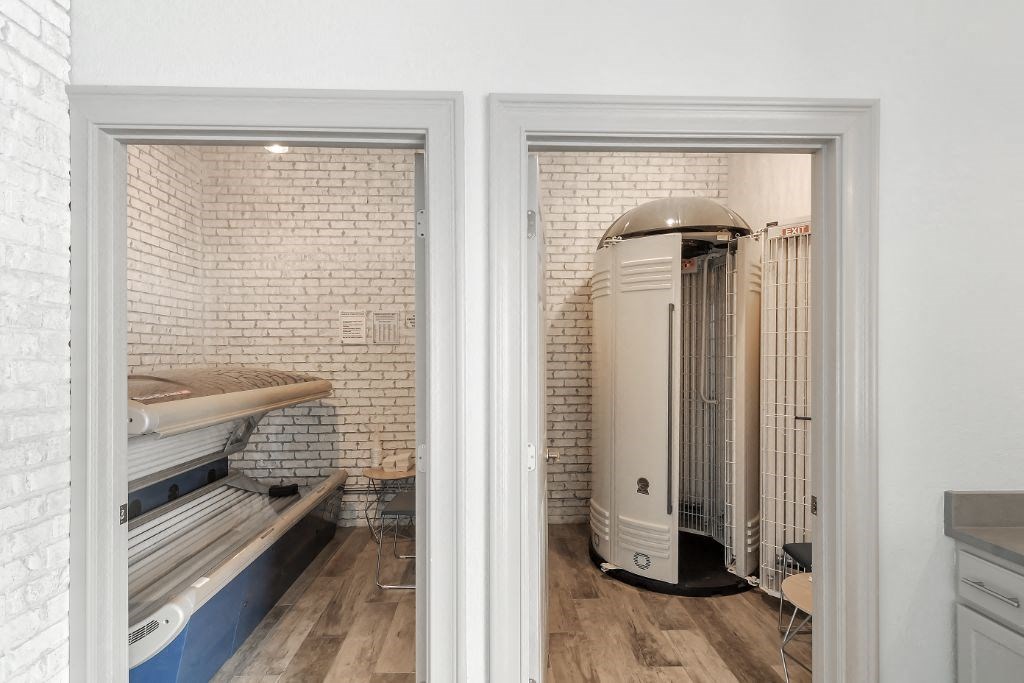 a boiler room with a wood floor and white walls  at Parkwest Apartment Homes, Hattiesburg, MS