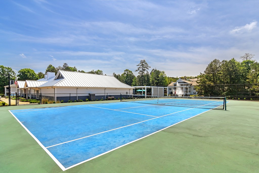 the tennis court at the whispering winds apartments in pearland at The Woodlands Apartment Homes, Mississippi