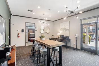 Business center with computer and conference table at Highpointe Apartment Homes, Mississippi  , 39042