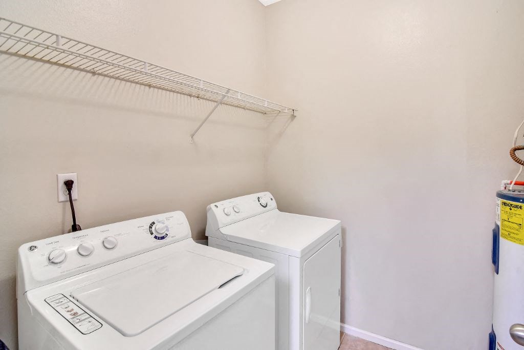 a laundry room with a washer and dryer at Ashford Place Apartment Homes, Flowood, 39232