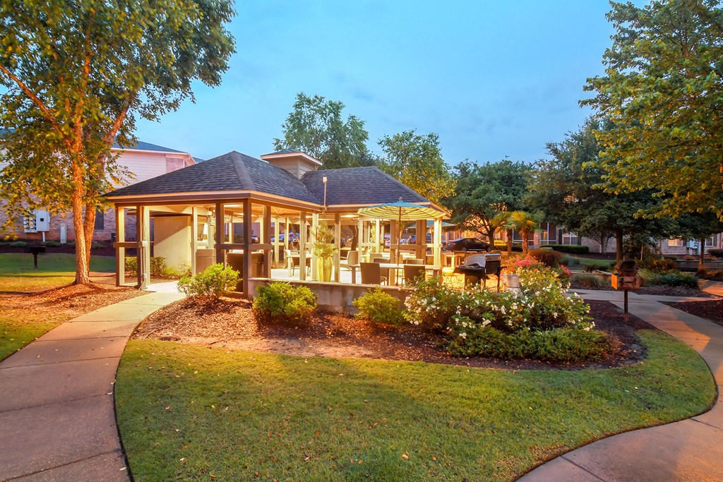 a park with a gazebo and a sidewalk at Ashford Place Apartment Homes, Flowood, Mississippi