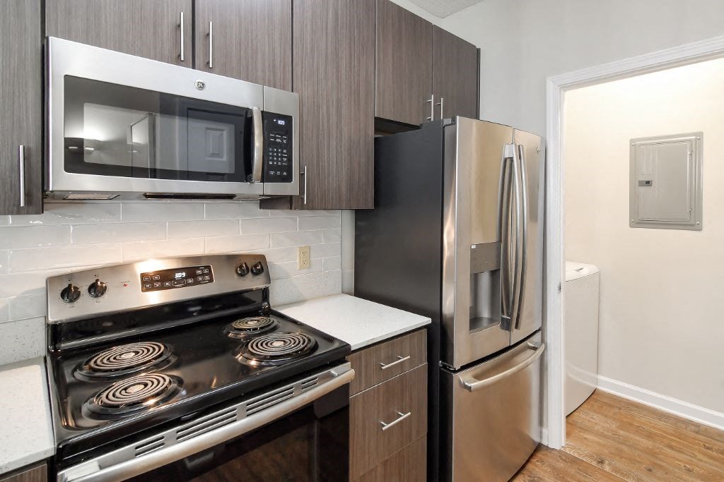 a kitchen with stainless steel appliances and wooden cabinets  at Legacy Apartment Homes, Ridgeland, MS, 39157