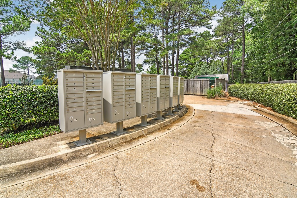 a row of mailboxes sitting on the side of a road at Lakeshore Pointe Apartment Homes, Brandon, MS, 39047