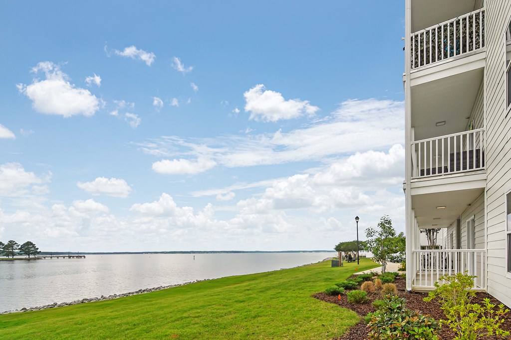 the view of the water from a balcony of a house at Lakeshore Pointe Apartment Homes, Brandon, 39047