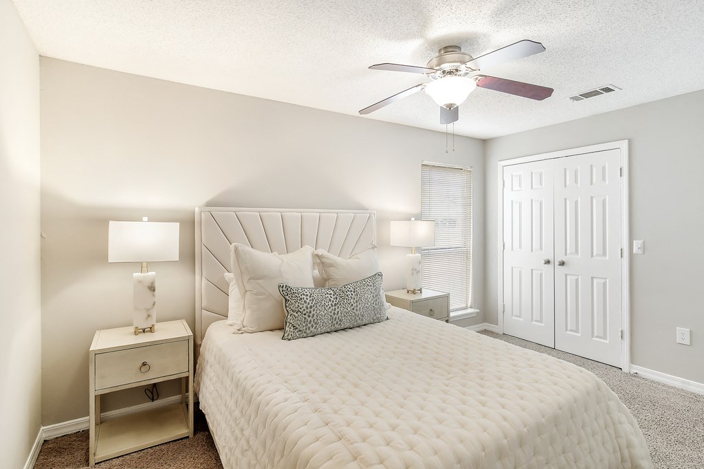 a bedroom with a large bed and a ceiling fan at Lakeshore Pointe Resort Apartment Homes, Brandon, 39047