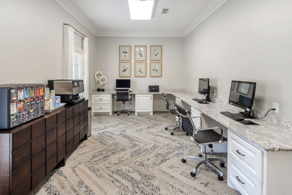 an office with two computers and two desks  at Bridgewater Apartment Homes, Mississippi