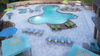 a view of the pool from above of a resort style pool at The Madison Apartment Homes in Tyler, TX 75703