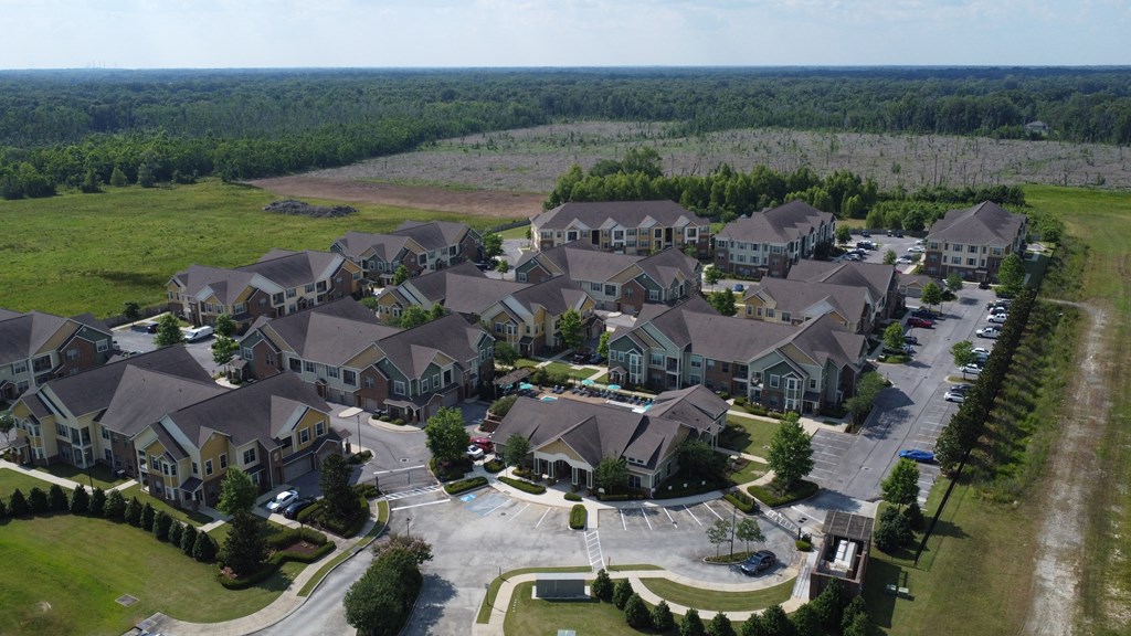 an aerial view of a large neighborhood with houses and roads at Audubon Park Apartment Homes, Louisiana