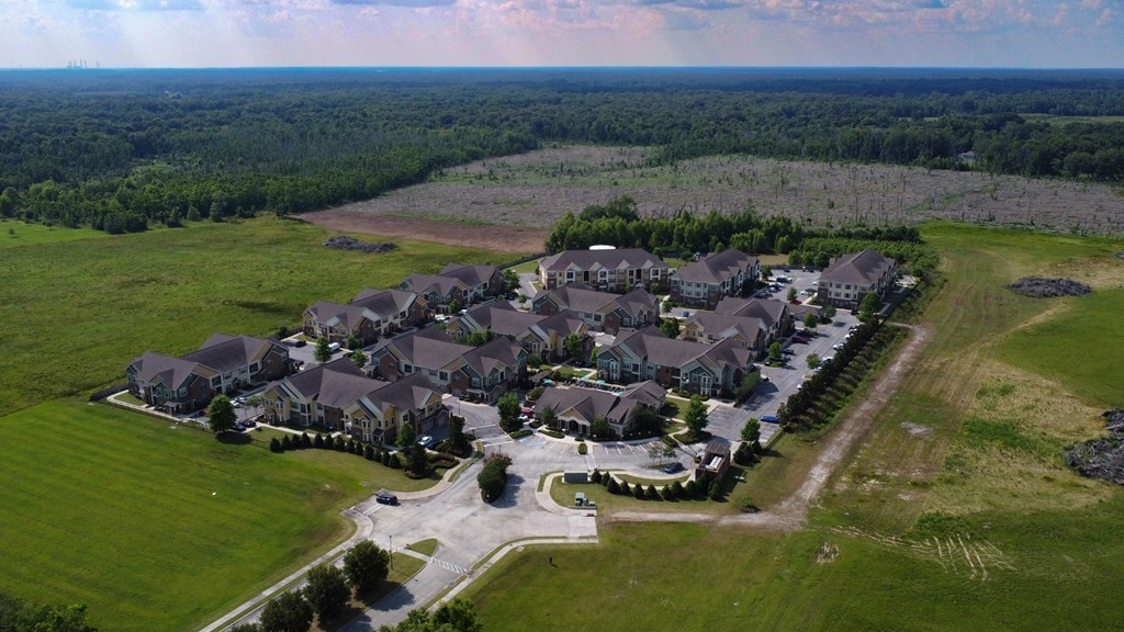 an aerial view of a large neighborhood of houses at Audubon Park Apartment Homes, Zachary, 70791