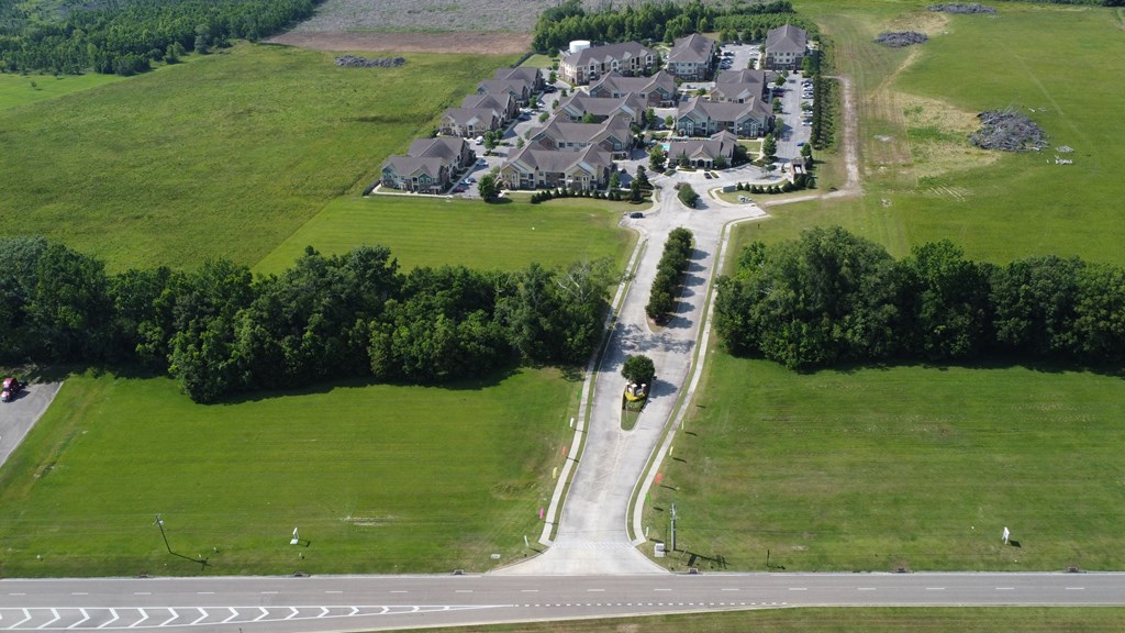 an aerial view of a neighborhood of houses on a road at Audubon Park Apartment Homes, LA