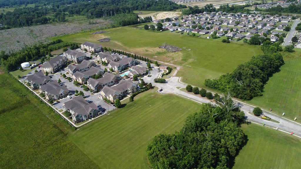 an aerial view of a suburban neighborhood with houses and grass at Audubon Park Apartment Homes, Louisiana