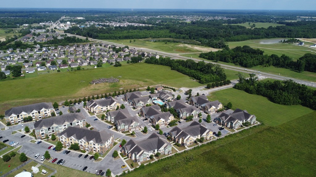 an aerial view of a suburban neighborhood with houses and grass at Audubon Park Apartment Homes, Zachary, 70791