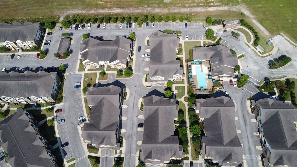 an aerial view of several houses in a parking lot at Audubon Park Apartment Homes, Louisiana, 70791