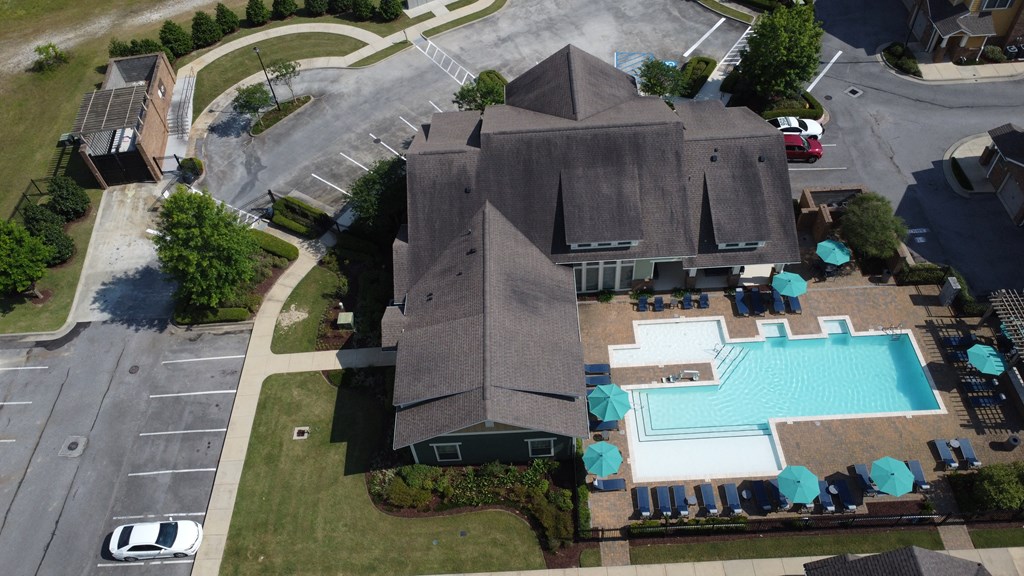 an aerial view of a house with a swimming pool at Audubon Park Apartment Homes, Zachary