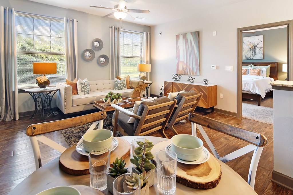 a living room and dining room with a table and chairs at Audubon Park Apartment Homes, Louisiana, 70791