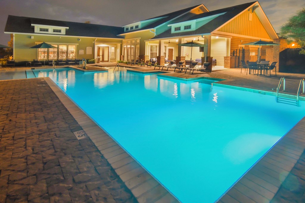 the swimming pool at the resort at night at Audubon Park Apartment Homes, Zachary, 70791