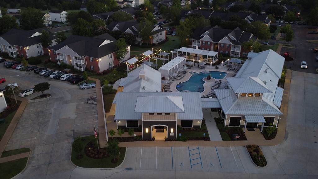 an aerial view of a large house with a swimming pool at Avalon Apartment Homes, Mississippi