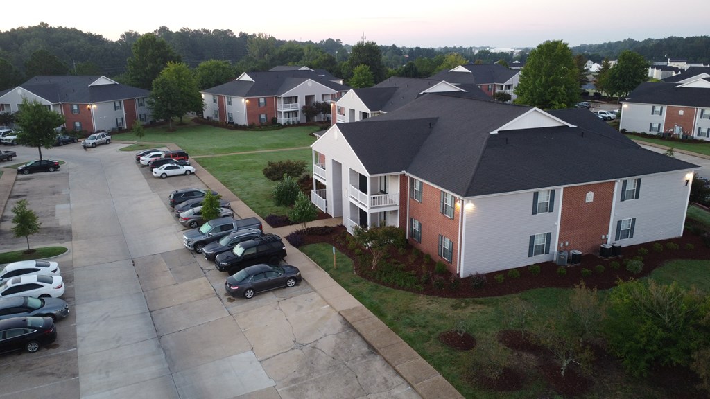 an aerial view of a neighborhood with houses and cars parked at Avalon Apartment Homes, Starkville, 39759