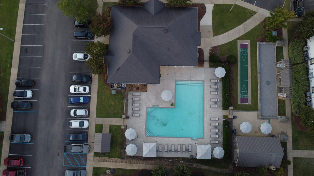 arial view of a swimming pool in the middle of a house at Avalon Apartment Homes, Starkville