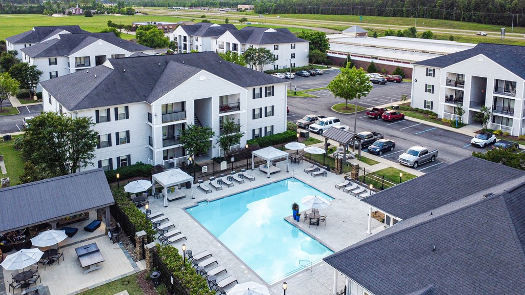 an aerial view of a swimming pool in the center of an apartment complex at Avalon Apartment Homes, Starkville, Mississippi, 39759