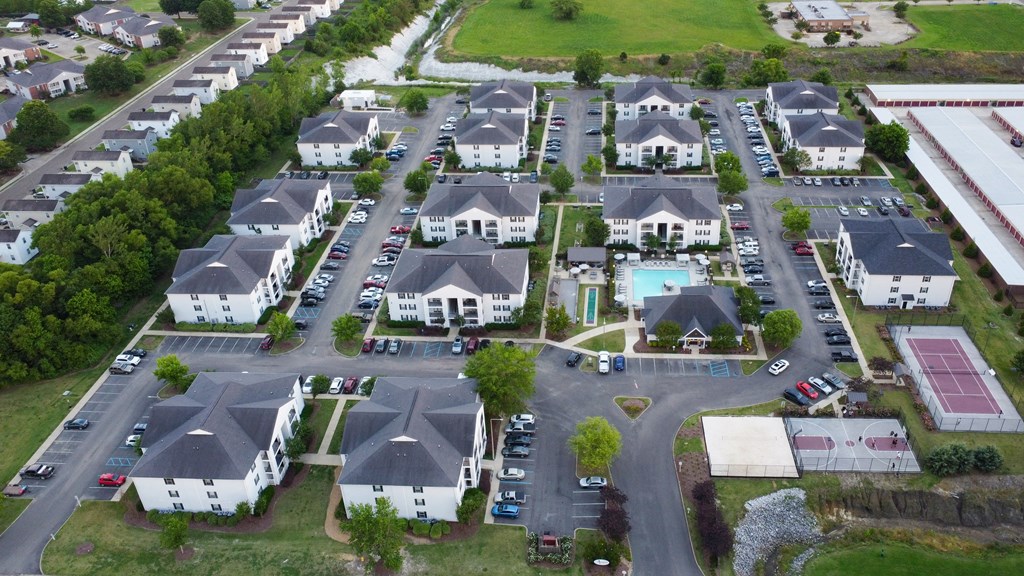 an aerial view of a neighborhood of houses with cars parked at Avalon Apartment Homes, Starkville, MS, 39759