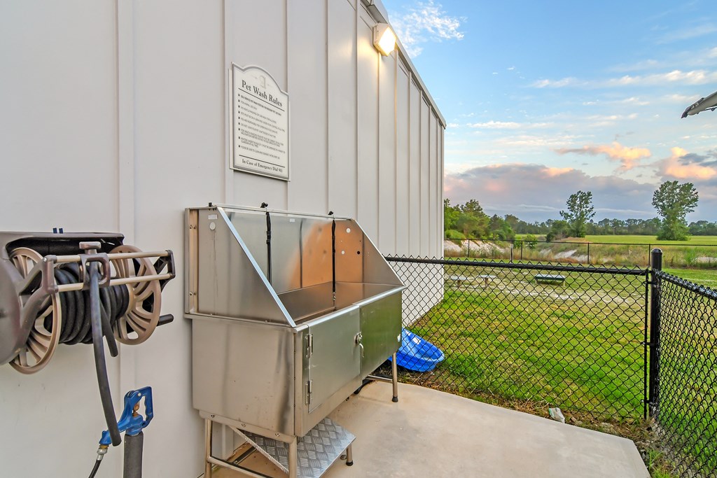 the residence apartment building has a refrigerator on the patio at Avalon Apartment Homes, Starkville, Mississippi