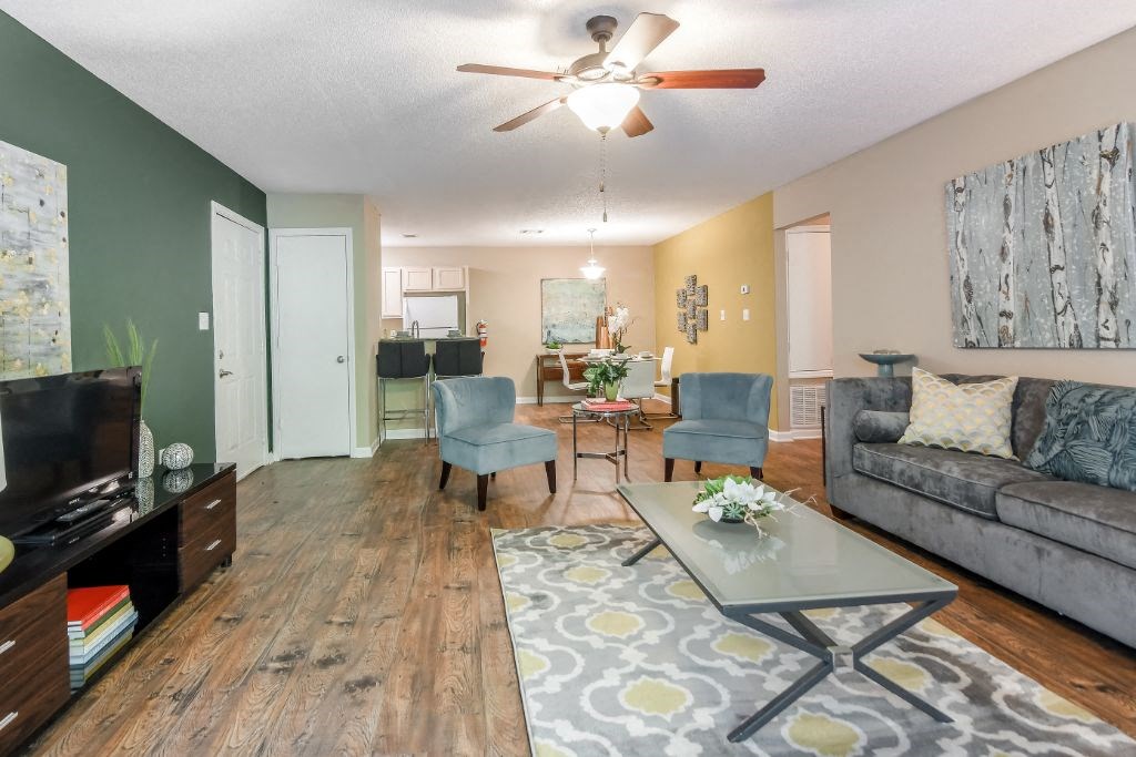 a living room with a couch and a table at Avalon Apartment Homes, Starkville, Mississippi