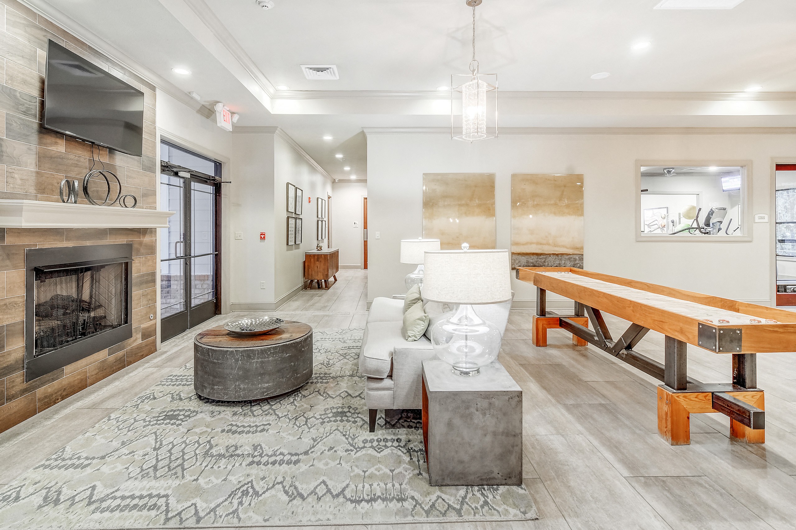 the preserve at ballantyne commons living room with fireplace and table