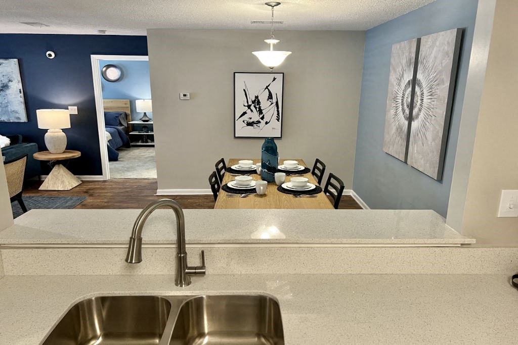 Kitchen with a View of the Dining Room at Reserve at Park Place Apartment Homes, Hattiesburg, MS, 39402