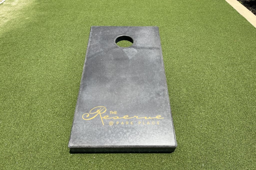 Fun Cornhole Game at Reserve at Park Place Apartment Homes, Mississippi, 39402