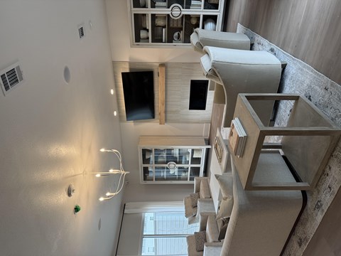 A view of a staircase with a light on the wall.