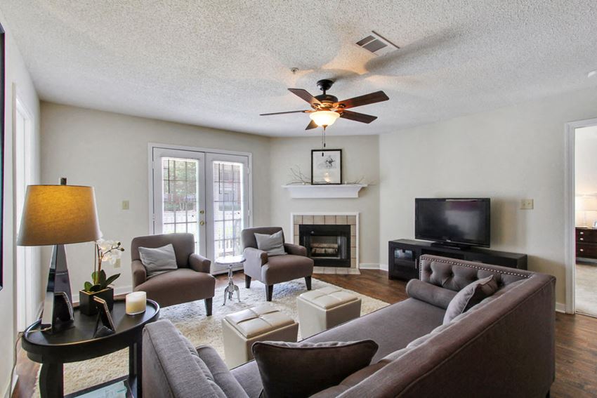 Open Living Room with a Fireplace at Reserve at Woodchase Apartment Homes, Clinton, Mississippi, 39056 - Photo Gallery 1
