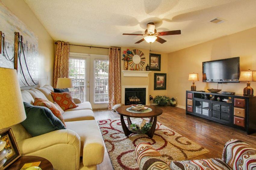 Living Room with Television at Reserve of Jackson Apartment Homes - Photo Gallery 1