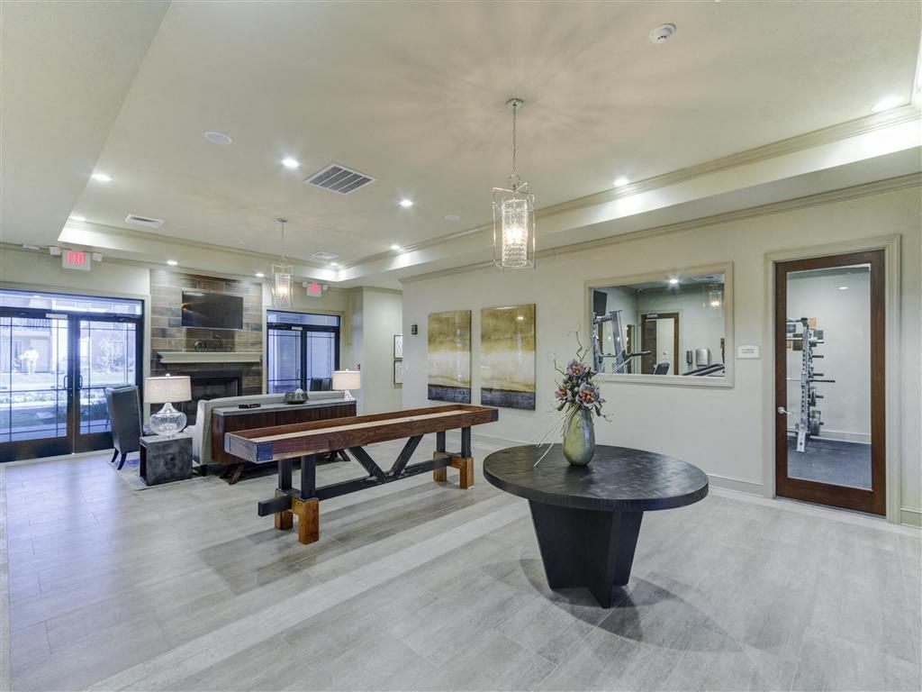 Clubhouse Living Room with Fireplace at Cambridge Station Apartment Homes, MS